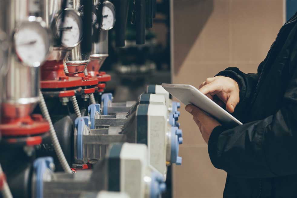 man checking the boilers