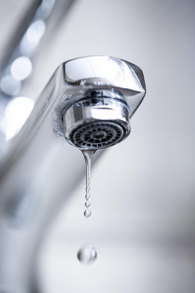 bg-plumbing-hidden-plumbing-leaks Chrome faucet with water leaking